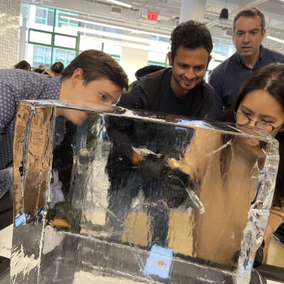 Participants focused on sculpting a block of ice during a Team building Ice Sculpting event, collaborating to create impressive works of art. thumbnail